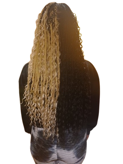 Woman facing forward with shoulder-length dark twists or braids